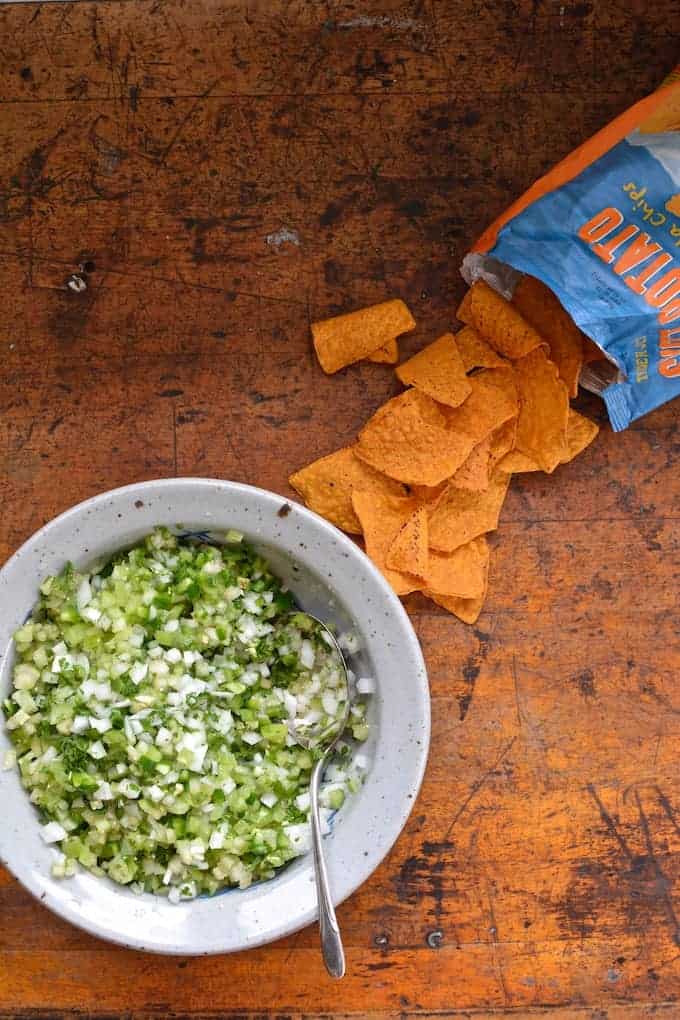 This fresh, raw Tomatillo Pico de Gallo is a zesty salsa that captures the essence of tart tomatillos, chiles, and onions. Perfect for chips or tacos. #tomatillo #tomatillosalsa #picodegallo #chipsandsalsa