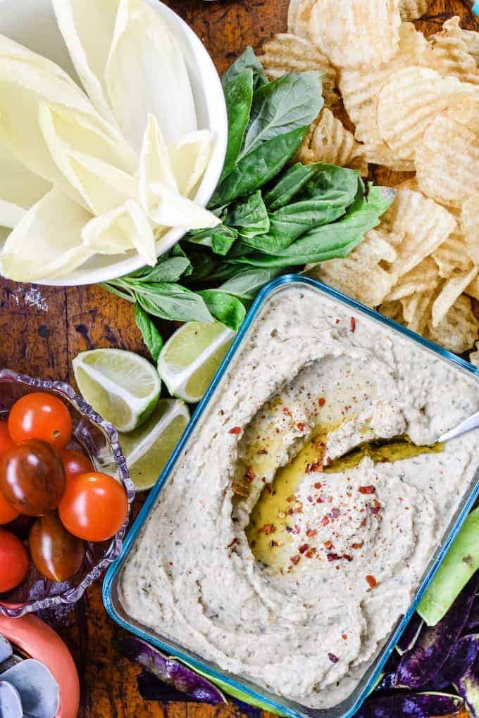 Simple, yet sophisticated this White Bean Dip with basil, garlic, and Worchestershire sauce is a creamy dip that is amazing with wheat crackers and veggies! #beandip #whitebeans #diprecipes #diprecipeseasy #holajalapeno