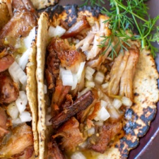 carnitas tacos with onions and cilantro