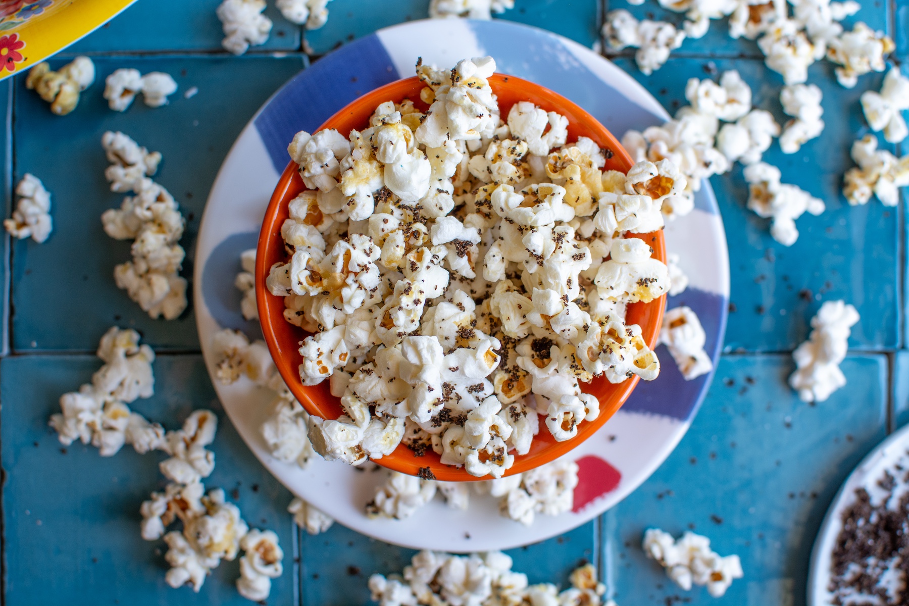 chili lime popcorn in an orange bowl