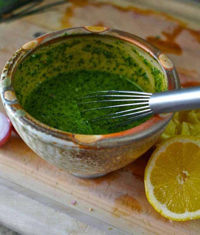 Toss your summer salads with this cilantro pesto vinaigrette made with homemade cilantro pesto, lemon juice, olive oil and shallots. Dairy free!