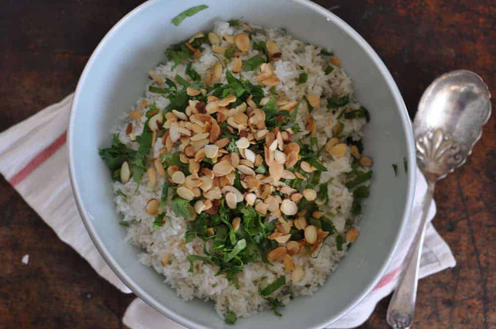 This coconut-cilantro rice is an easy and delicious gluten-free side dish made with coconut milk and topped with fresh cilantro and toasted almonds.