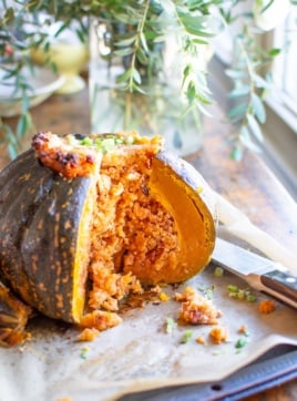 A stuffed pumpkin with a few slices taken out