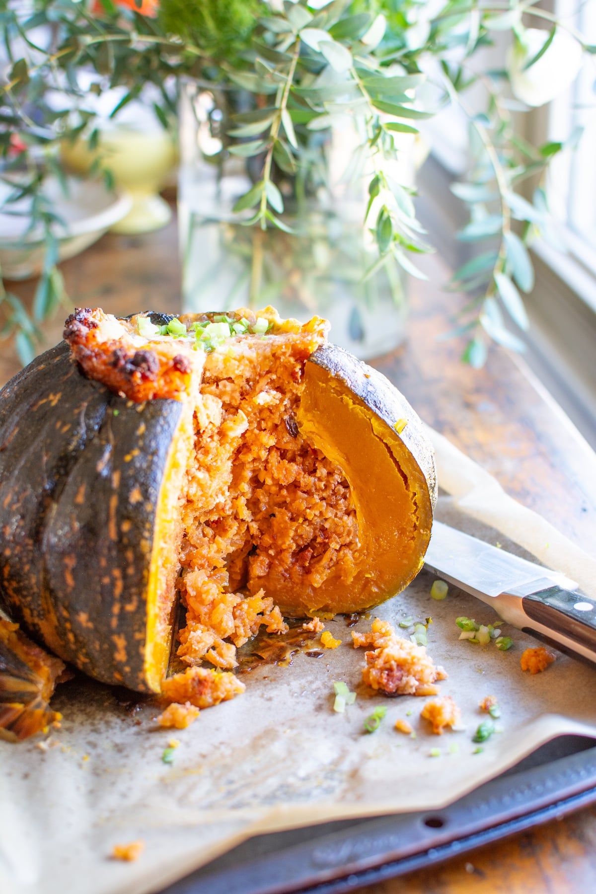 A stuffed pumpkin with a few slices taken out