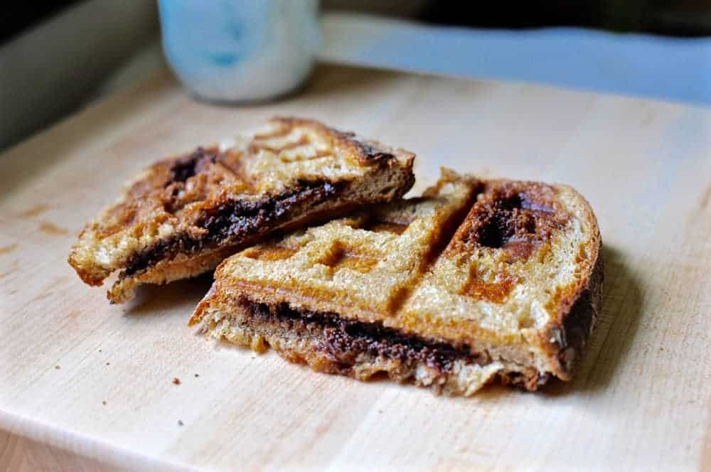 A Chocolate Waffle Iron Sandwich is a fun snack: Chocolate sandwiched between two slices of buttered country bread & toasted in a waffle iron until melted.