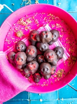 chocolate calaveras on a pink tray