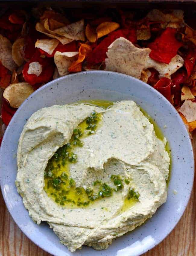 This cilantro jalapeño hummus adds a little Mexican flare to everyone's favorite dip with fresh cilantro, fiery jalapeños, and cumin.