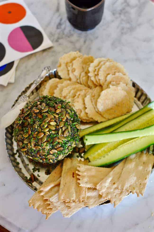 This manchego chipotle cheese ball is perfect for parties; coated with pumpkin and poppy seeds, and chives its a real crowd pleaser. Gluten-free!