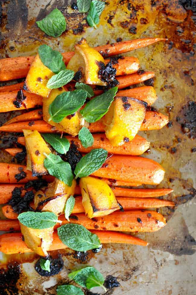 Sweet roasted carrots tossed in a chipotle and honey butter and sprinkled with fresh mint leaves. Gluten-free!
