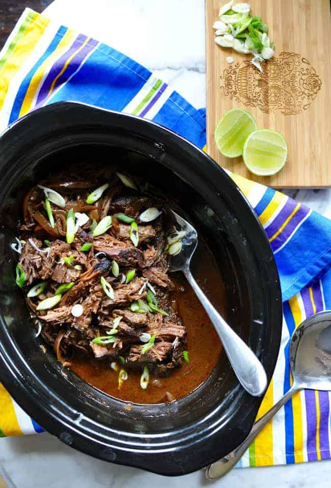 Slow cooker carne adobada just might be your new favorite way to cook a roast. Covered in adobo sauce and slowly simmered until tender its just delicious!