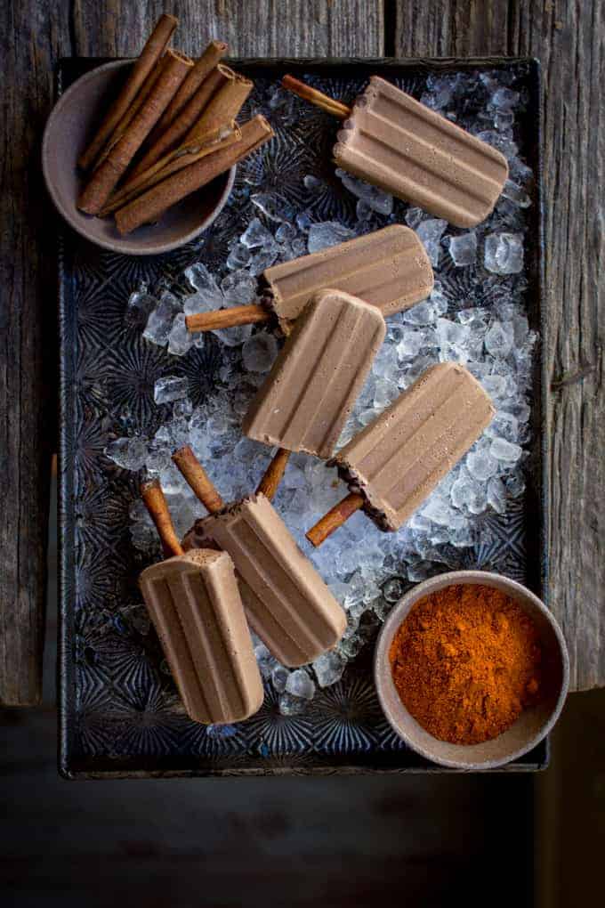 These super simple vegan Mexican chocolate popsicles are rich and creamy with hints of chili and cinnamon and chocolate and take about 10 minutes to make!