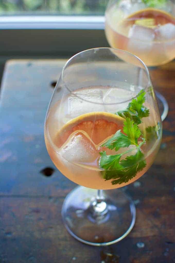 This pink grapefruit Spanish gin tonic is an ultra-refreshing sipper for summer. Flavored with cilantro-grapefruit syrup and a hefty splash of tonic.