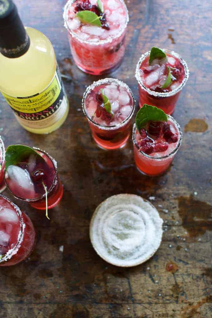 This skinny cherry margarita made with fresh sweet cherries and fragrant lime leaves is a cocktail you can sip on all summer and not feel an ounce of guilt.