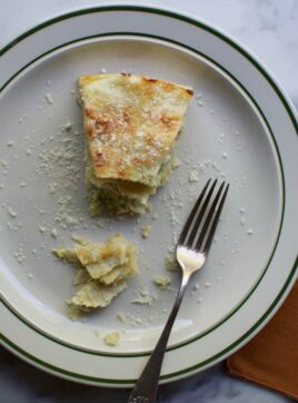 These Stacked Enchiladas Suizas combine creamy layers of green chile-coated tortillas, poached chicken, and two kinds of cheese into the best comfort food!