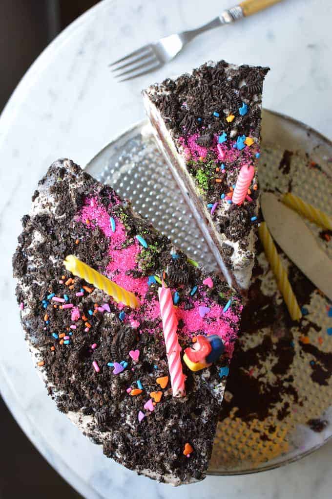 Make a Cookies and Cream Ice Cream Cake for your next birthday celebration! It has layers of chocolate cake, cookies and cream ice cream, and Oreo cookies.