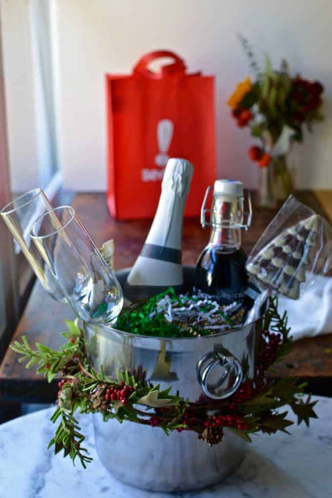 Hibiscus Mimosa Kits: Champagne, homemade hibiscus syrup, and sweet treats wrapped up in an ice bucket makes a lovely hostess gift for ladies who brunch.