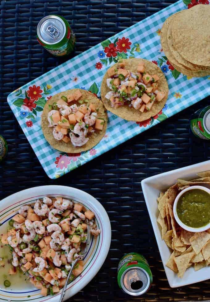 Jump into spring with this shrimp and melon ceviche! Pile this bright and citrusy salad on top of crunchy tostadas for a light meal or an easy appetizer at your next backyard party. #shrimpceviche #healthyLatinrecipe #cevicherecipe