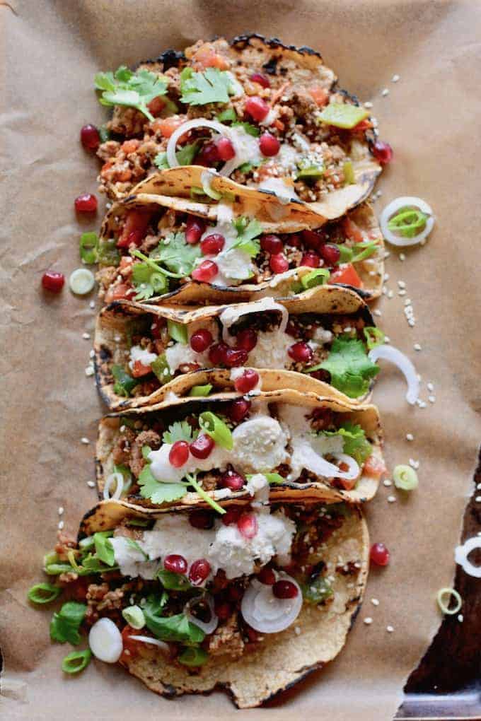 Chiles en Nogada tacos wrap everything we love about the Mexican Independence Day dish—tender meat, pomegranate seeds, walnut sauce—up in a warm tortilla. #chilesennogada #tacos #groundbeef #MexicanIndependenceday #september16
