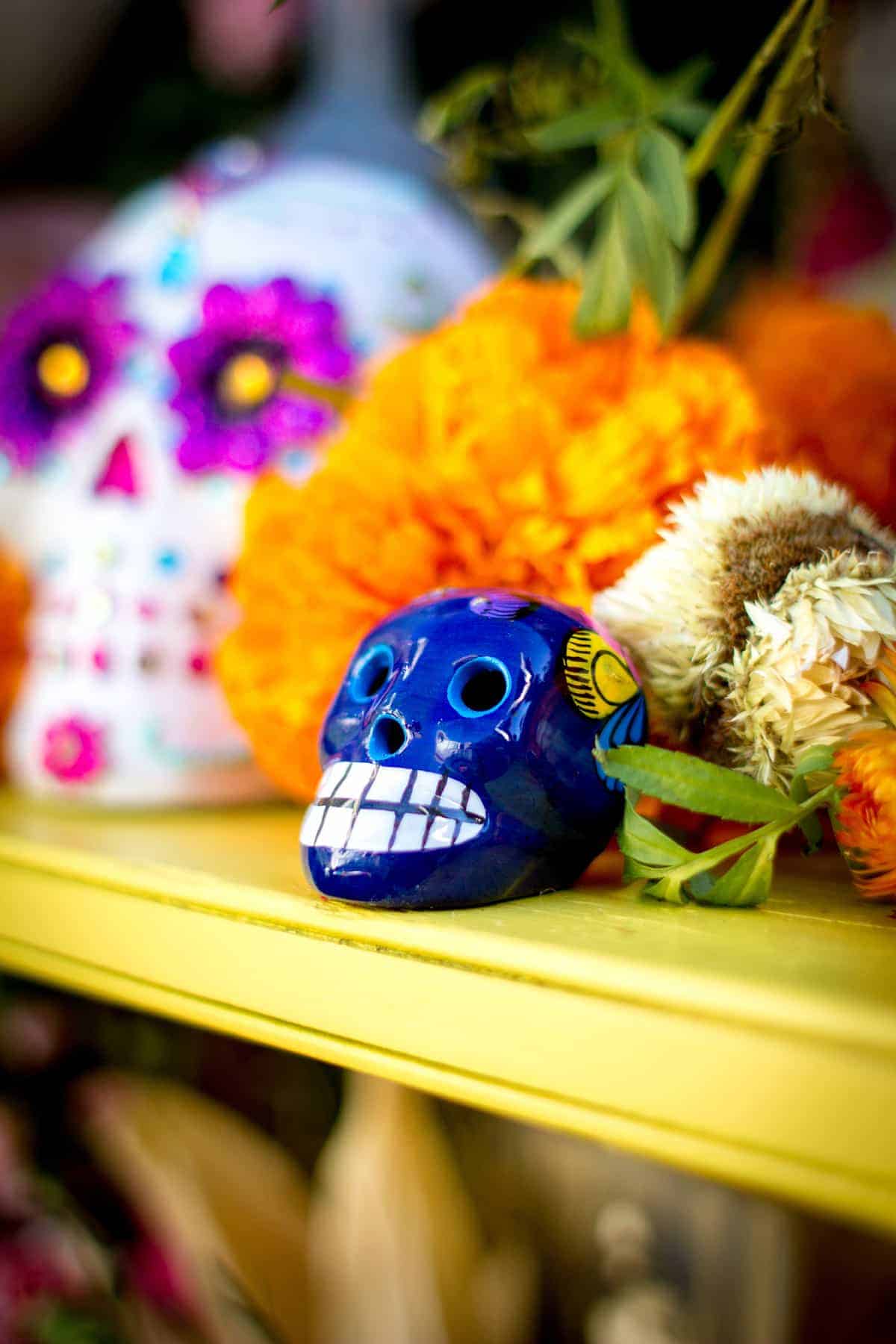 A Day of the Dead Altar is the focal point of holiday celebrations. Everything from candles to incense, Papel Picado to even Pan de Muerto can be ordered online. Here are 10 essentials to order now to prepare your Ofrenda by October 31. #dayofthedead #diadelosmuertos #ofrenda #dayofthedeadaltar