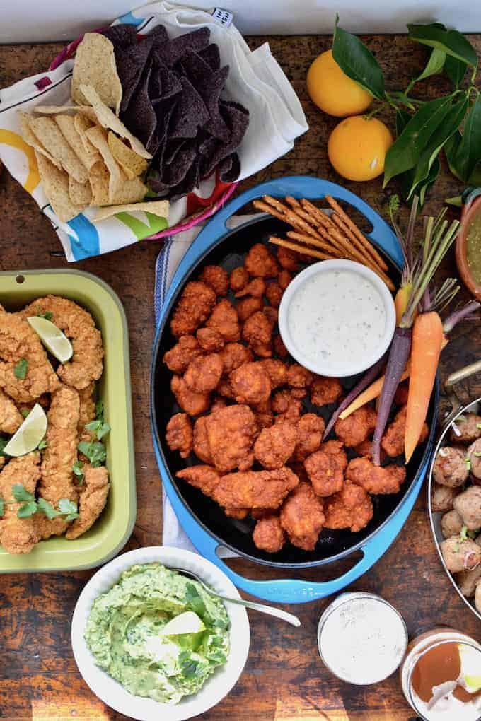 Seven strategies for hosting a stress-free Game Day party. Because chilling and watching the big game with friends is supposed to be relaxing. Don't freak out over the perfect football-shaped cake, pick up some store-bought apps, make a few easy dips, then just sit back and enjoy the game! #SuperBowl #easysuperbowlparty #SuperBowlPartyIdeas #gameday