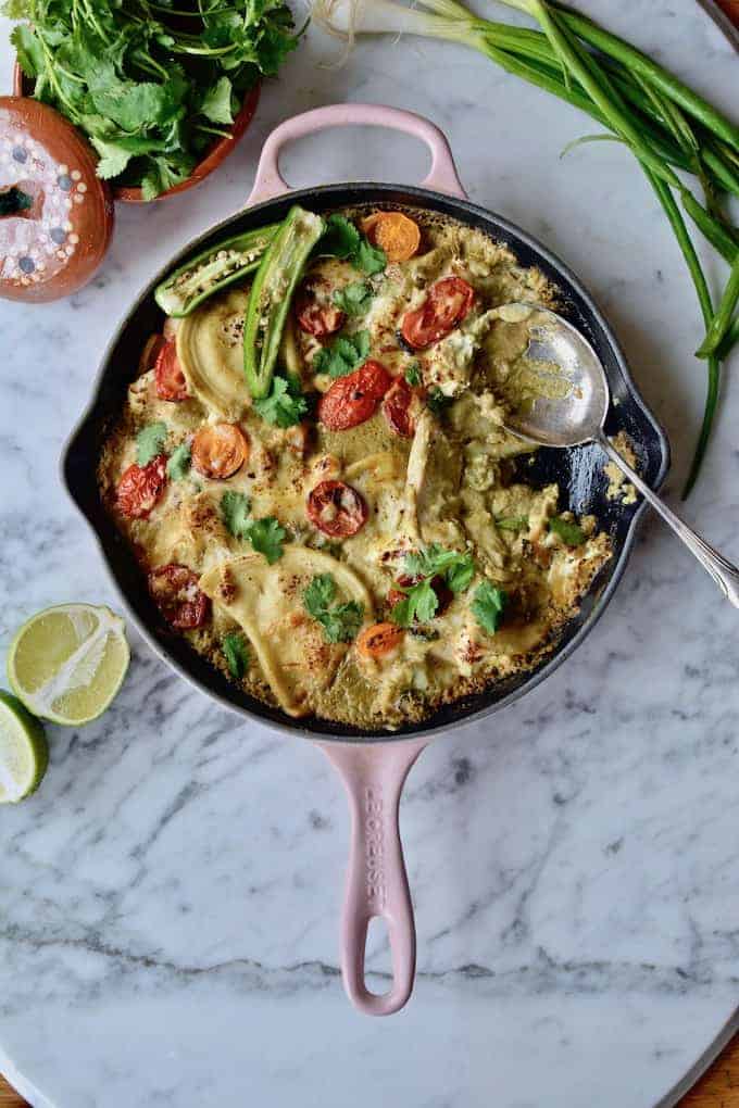 #ad| @MrsTsPierogies fill in for traditional tortillas and cheese in these Pierogy Skillet Enchiladas, made with green sauce, chicken, tomatoes and cheese. #pierogies #enchiladas #skilletenchiladas #easyenchiladas #chickenenchiladas #easydinner