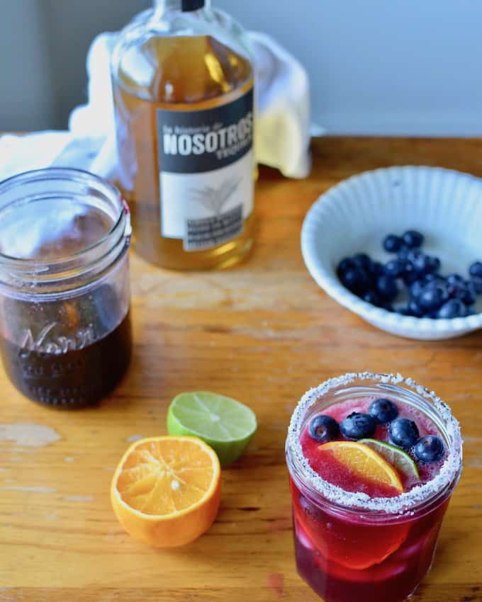There are a 101 ways to enjoy blueberries but a Blueberry Rose Margarita has got to be my favorite. A splash of rose water adds the perfect floral touch. #blueberrymargarita #margarita #blueberries #margaritarecipe