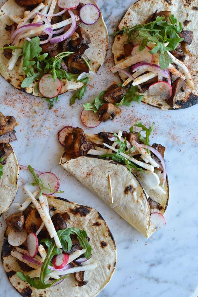 Vegan chipotle mushroom tacos for those nights when you want something satisfying but aren't starving. Full of flavor and texture with a jicama slaw on top. #vegantacos #mushroomtacos #vegantacorecipe #meatlesstacos