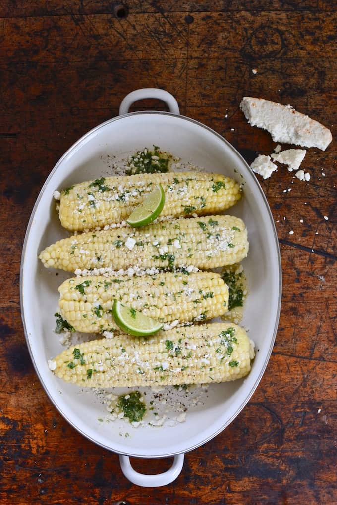 This Cilantro-Lime Corn, steamed and covered in cilantro butter and cotija, is the perfect summer side dish from Katie Sullivan Morford's new book, Prep. #sweetcorn #streetcorn #cornonthecob #Mexicanstreetcorn