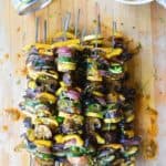 Grilled veggie skewers are the perfect way to celebrate summer produce, especially when drizzled with a smoky green chile vinaigrette! #skewers #vegandinner #grilledvegetables #greenchiles #ad #holajalapeno