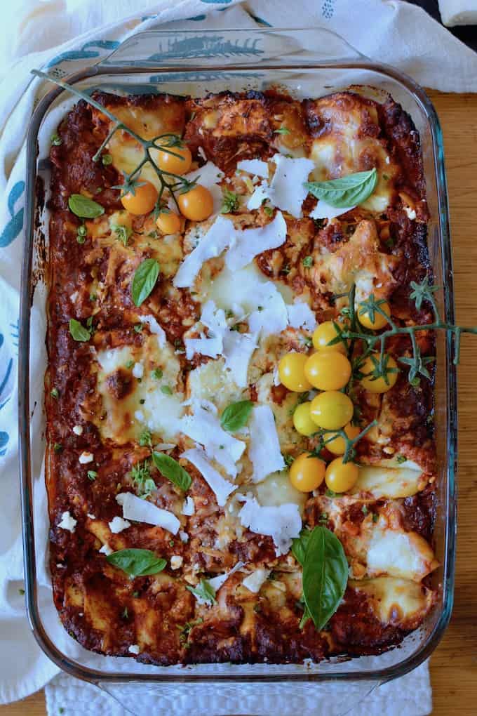 Green chiles, chorizo bolognese sauce, creamy layers of pasta and three different cheeses make this Mexican Lasagna Recipe your next potluck's best friend. #ad #holajalapeno #mexicanlasagna