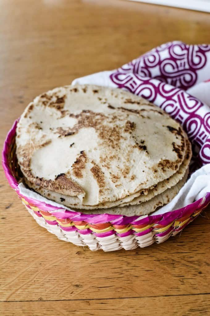 All the best tips and tricks for how to make tortillas at home. Homemade corn tortillas are a lot easier than you think and taste absolutely incredible! #corntortillas #howtomaketortillas #homemadetortillas #tortillarecipe #corntortillarecipe
