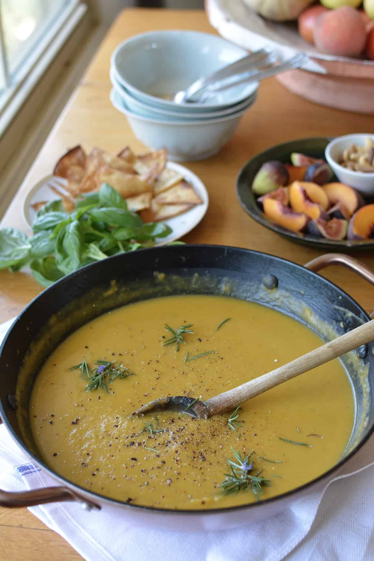 Homemade Roasted Squash Soup with just 10 ingredients! This soup recipe is healthy and has a deliciously creamy flavor with coconut milk, ground coriander, and guajillo chili powder. A super easy vegan and naturally gluten-free comfort food recipe! #roastedsquashsoup #butternutsquashsoup #vegansoup #easysoup