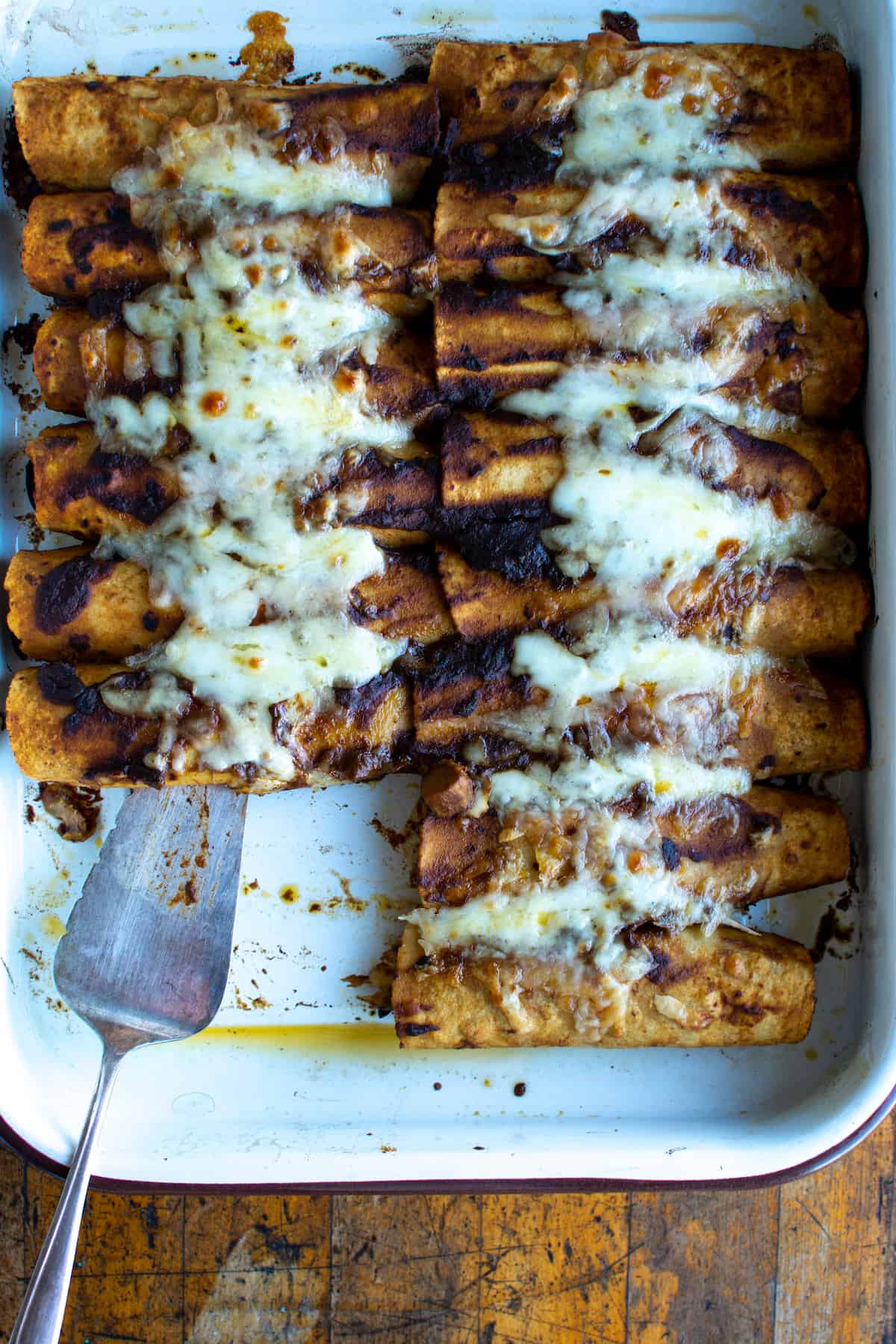 Vegetarian Enchiladas with sautéed shiitake mushrooms and a blend of creamy Oaxaca cheese and sharp Gruyere. Top with guacamole and Mexican crema for an easy, healthy Cinco de Mayo recipe! This year celebrate en su casa with the most perfect vegetarian enchilada recipe. #ad #vegetarianenchiladas #enchiladas #enchiladarecipe #latortillafactory