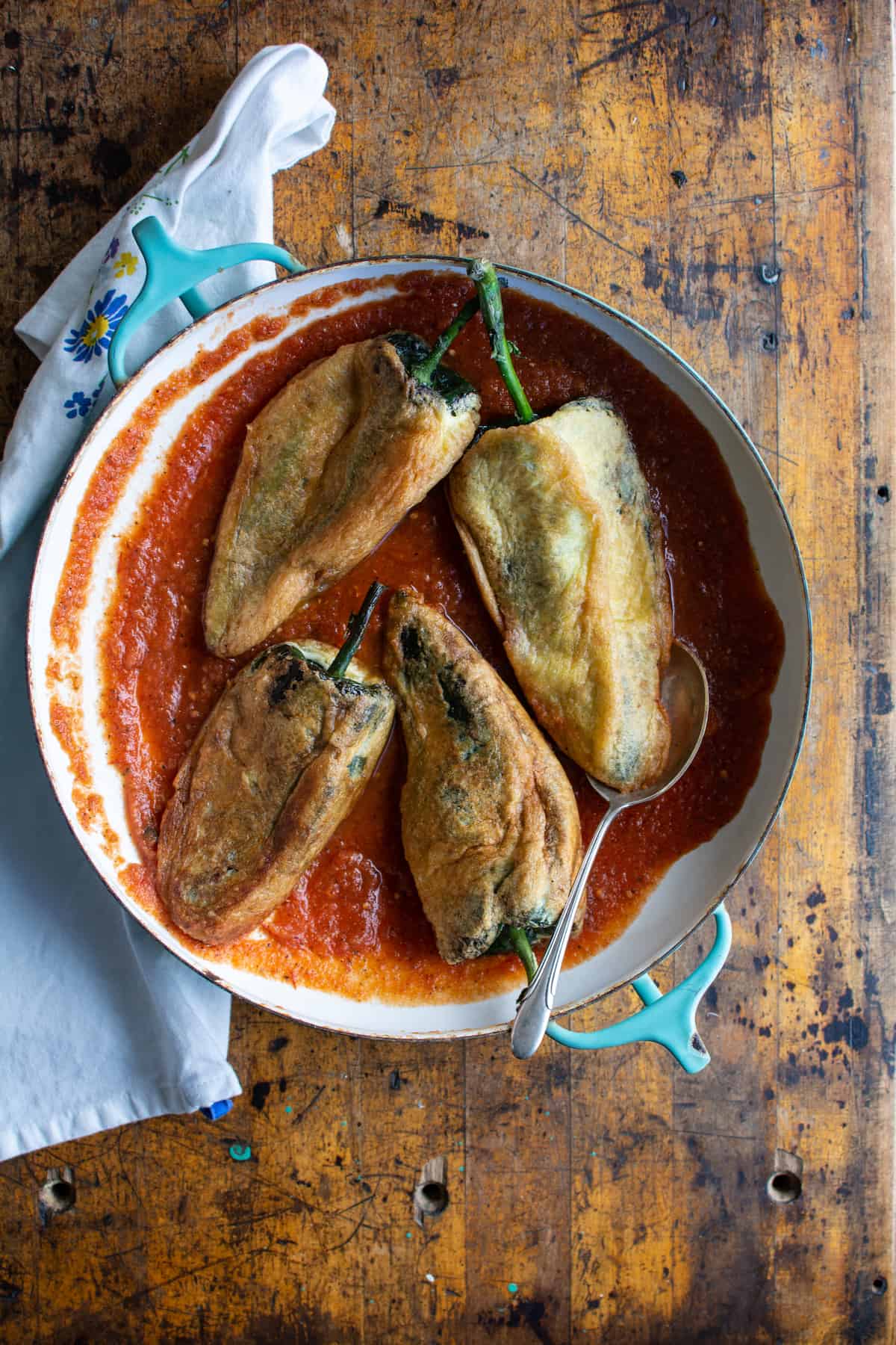 This Authentic Chile Relleno Recipe takes you step-by-step on how to make this traditional Mexican dish of poblano peppers stuffed with cheese, dipped in egg batter and lightly fried. Serve with frijoles de olla, a crisp salad, and salsa ranchera—Ugh, so good! #chilerelleno #mexicanfood #vegetarian #holajalapeno