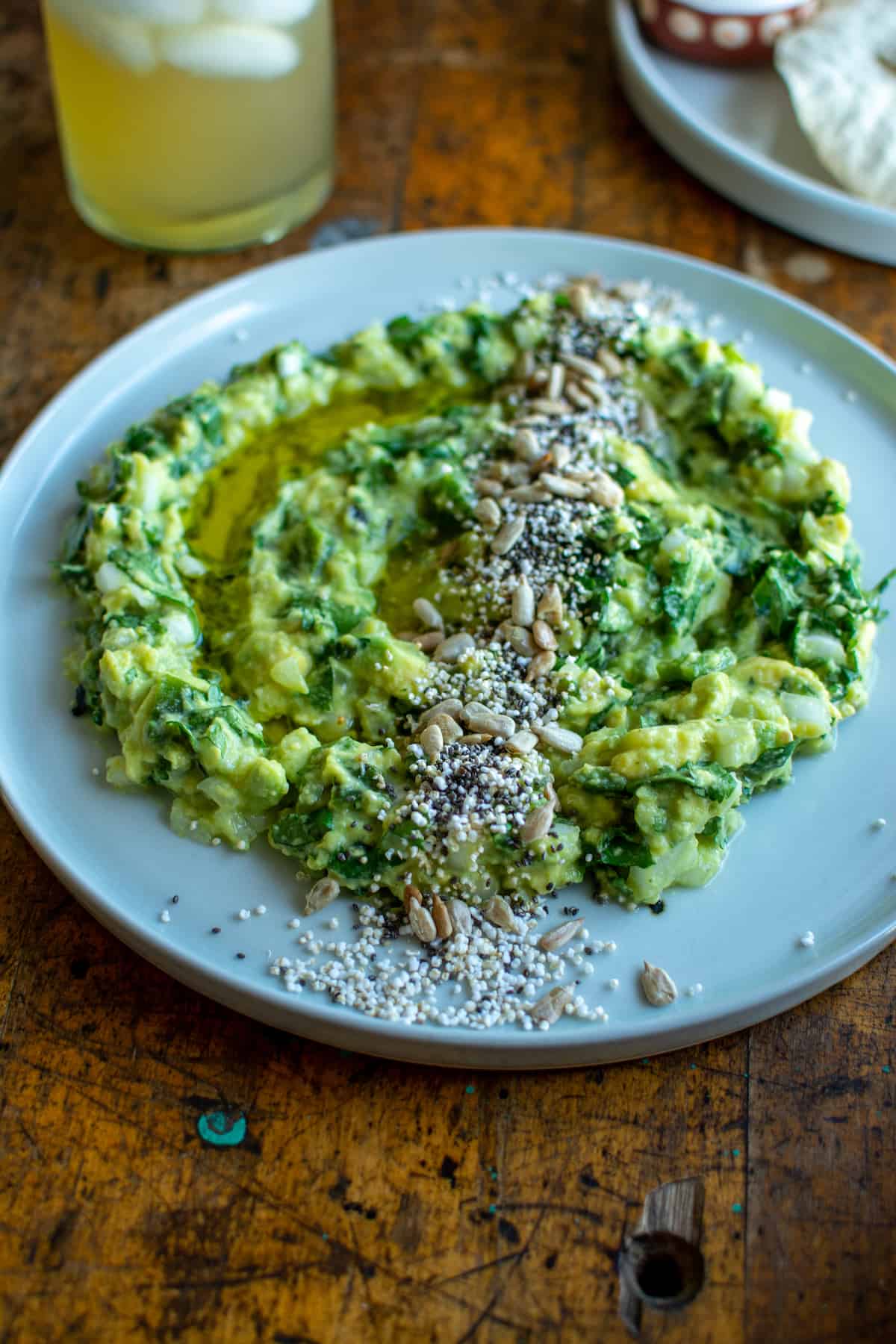 Homemade guacamole with a twist! This Charred Poblano Guacamole has all the creamy avocado goodness you love plus charry bits of poblano pepper and jalapeños that takes it to a whole new level of delicious. Vegan and gluten-free! #guacamole #ad #avocados #cagrown #caavocados