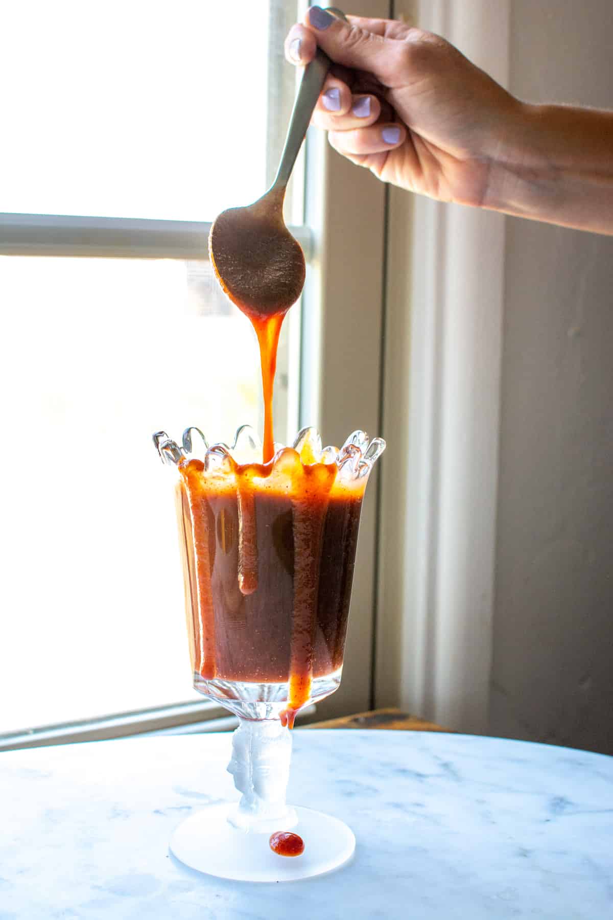Homemade Chamoy sauce is a thing of beauty. This sweet, salty, sour, spicy sauce is an explosion of flavor and completely addictive. Drizzle over fresh fruit, rim your cocktail glass, heck, eat it with a spoon! I guarantee you'll find a million and one reasons to make this sauce. Vegan and gluten-free! #chamoy #holajalapeno #chamoysauce #homemadechamoy