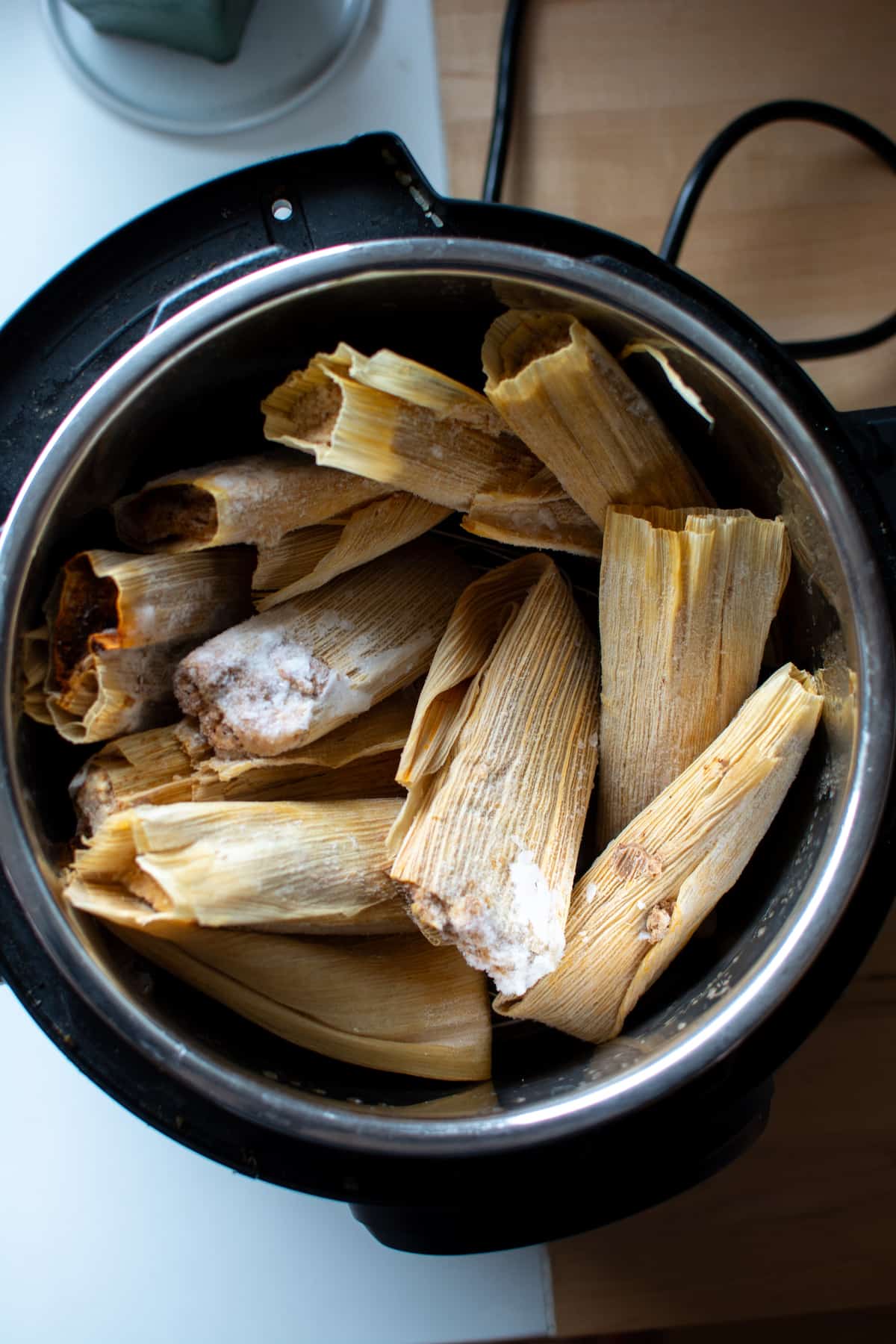 Tamales in an instant pot getting ready to be heated.