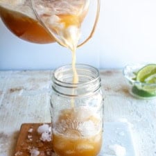 Tamarind agua fresca being poured into a glass