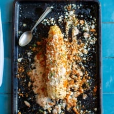 An elote loco on a baking sheet