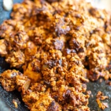 soy chorizo in a pan with a spoon in it