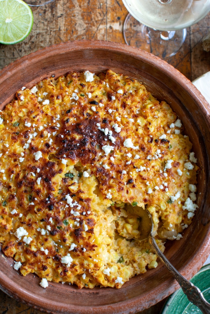 The casserole with a scoop taken out of it