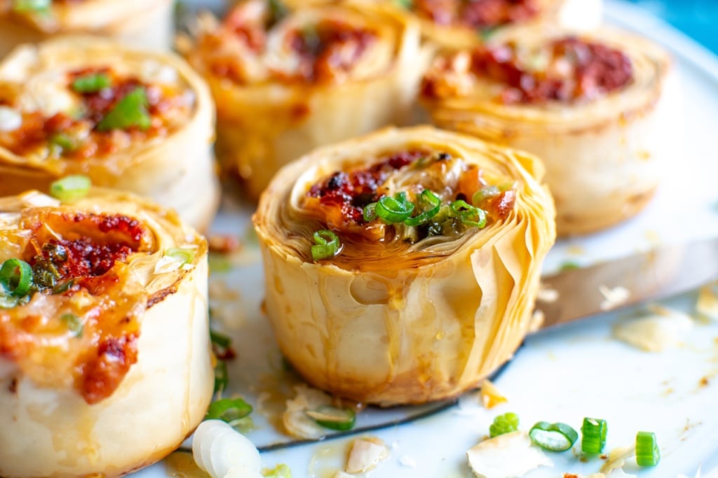 A close up of a choriqueso pinwheel appetizer