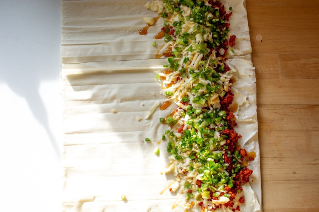 The filling on the rolled out piece of phyllo dough