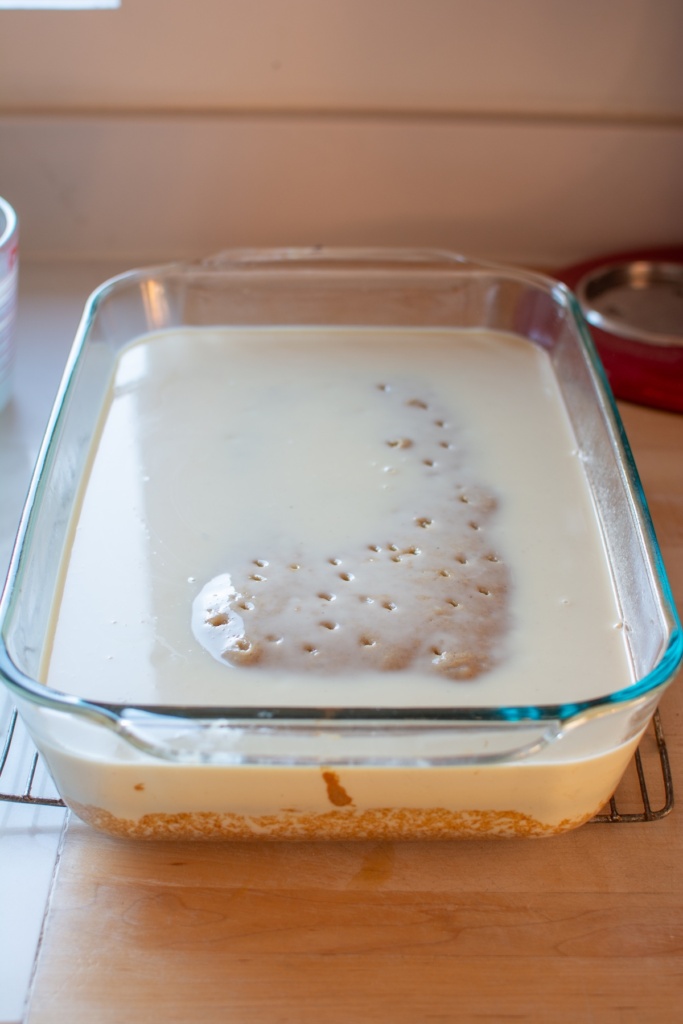 The cake covered in the tres leches mixture