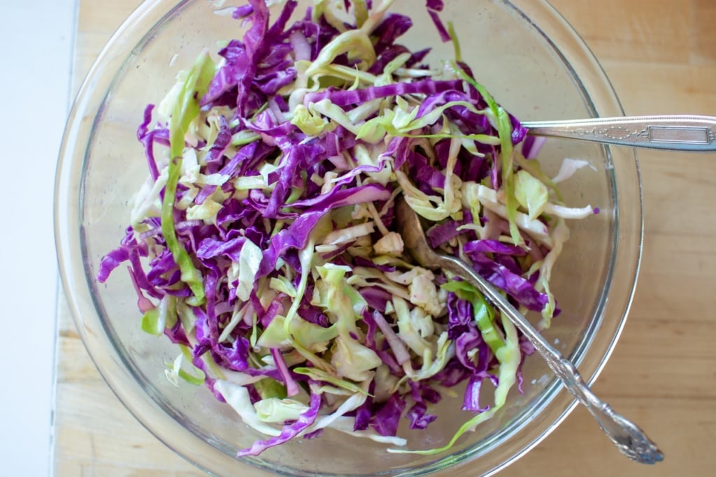 green and red cabbage in a glass bowl