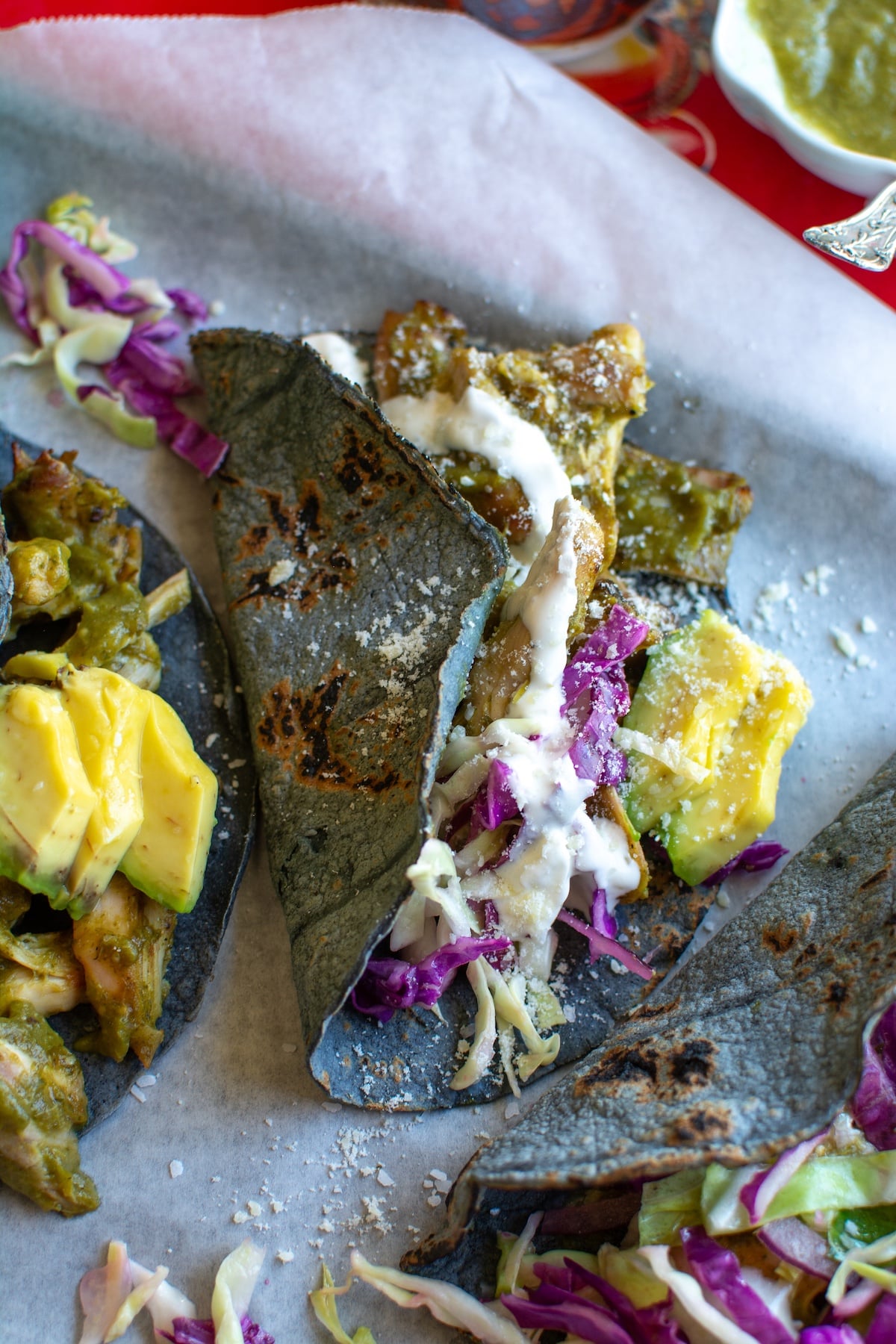 several chili verde chicken tacos on a sheet pan