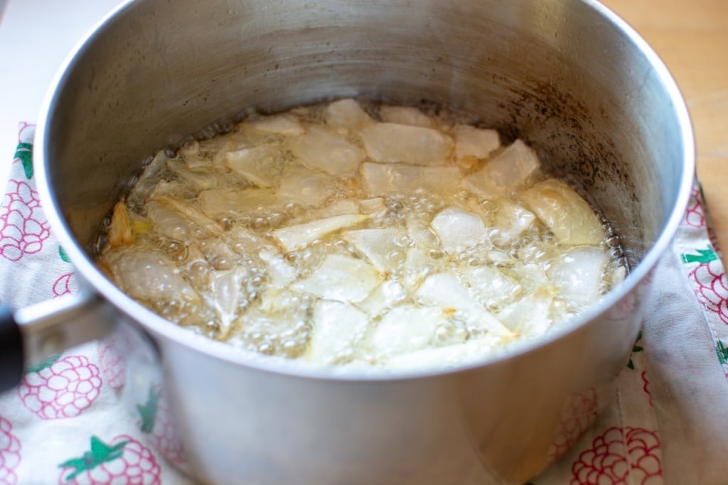 The onions frying in the oil to make the chili oil.
