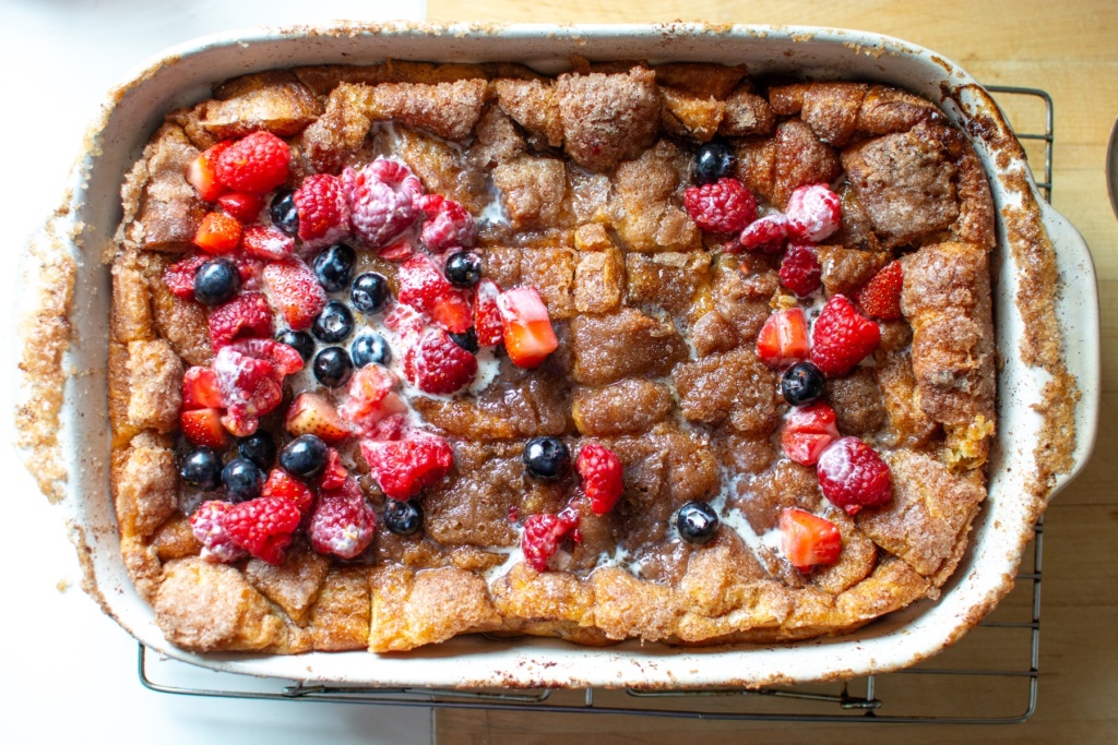 churro French toast casserole with berries on top