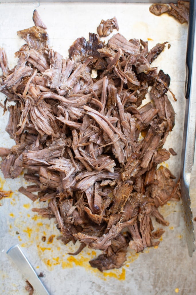 The meat shredded on a baking sheet