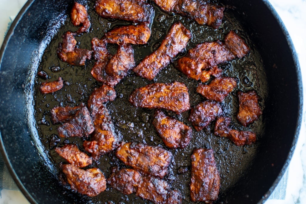 Adobada meat in a cast iron skillet. 